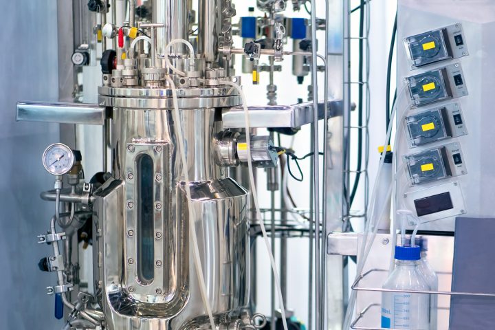 Bioreactor. Cultivation of microorganisms in the bioreactor. The creation of drugs. Microbiology. Biotech industry. Pharmacology. Laboratory fermenter. Microbial fermentation.